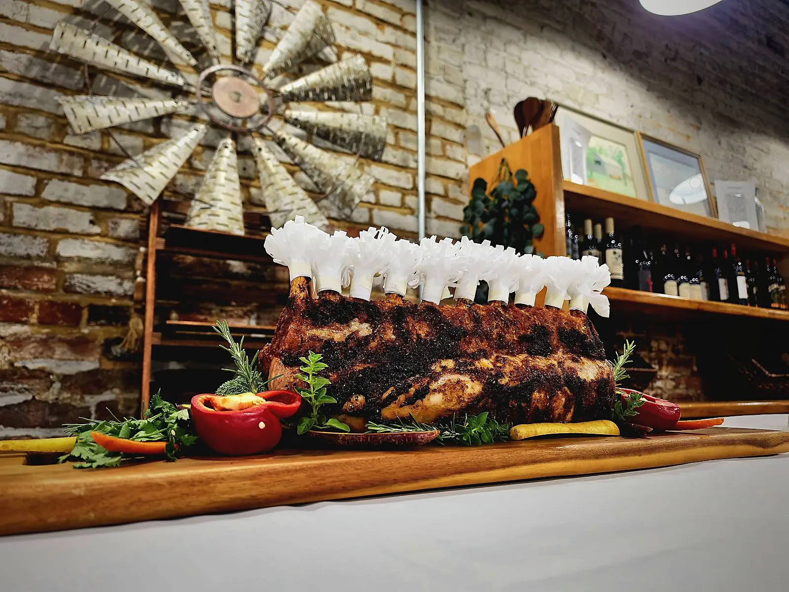 A frilled crown roast staged on a board in the shop